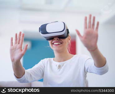 Smile happy woman getting experience using VR-headset glasses of virtual reality at home