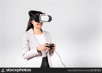 Smile woman confidence excited wear 3D VR headset device and playing game virtual reality experience with joystick isolated white background, Asian happy female play video game studio shot,copy space