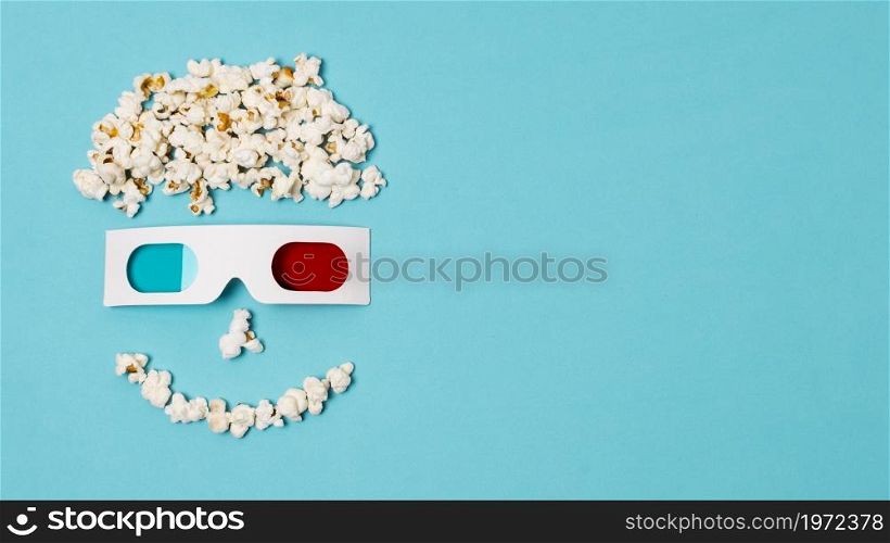 smiley anthropomorphic face made with popcorns 3d glasses cinema time text. High resolution photo. smiley anthropomorphic face made with popcorns 3d glasses cinema time text. High quality photo