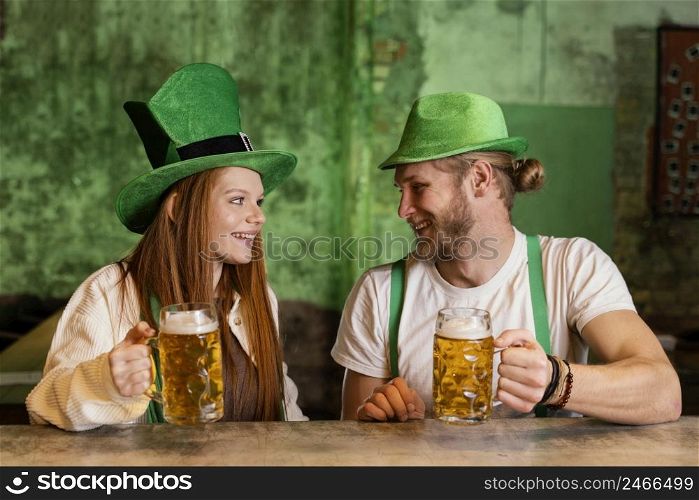 smiley couple celebrating st patrick s day bar