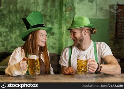 smiley couple celebrating st patrick s day bar