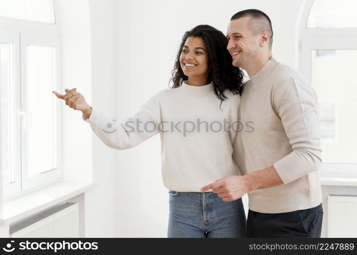 smiley couple enjoying their new house