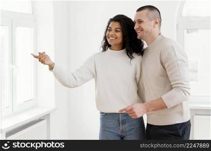 smiley couple enjoying their new house