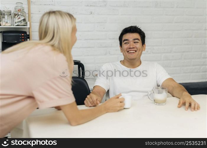 smiley couple home during pandemic conversing