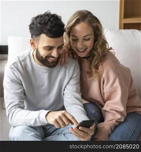 smiley couple suing smartphone home