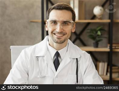 smiley doctor wearing goggles