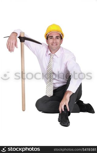Smiley engineer posing with a pickaxe