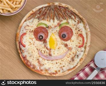 Smiley Faced Pizza with a Portion of Chips