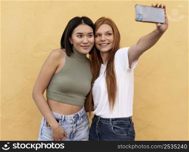 smiley friends taking selfie together