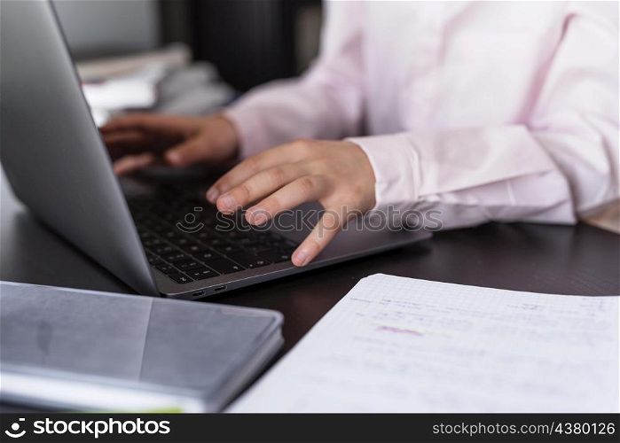 smiley girl using her laptop keyboard