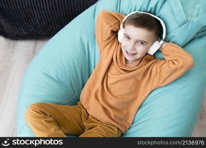 smiley kid sitting bean bag chair