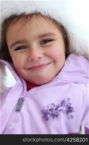 Smiley little girl in winter coat