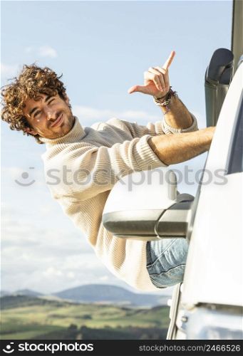 smiley man enjoying road trip