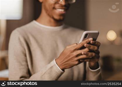 smiley man using modern smartphone