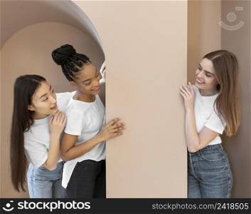 smiley multicultural women indoors