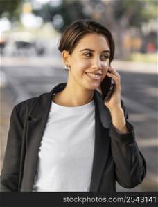 smiley stylish woman talking phone outdoors 2