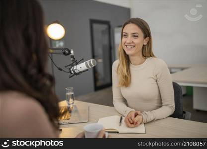 smiley woman broadcasting interview radio