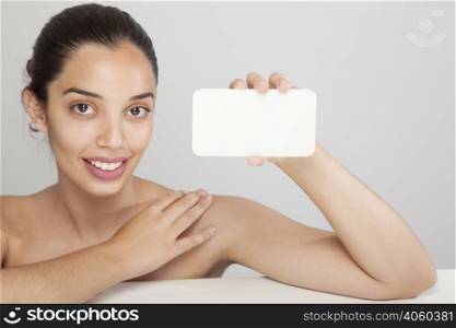 smiley woman holding card
