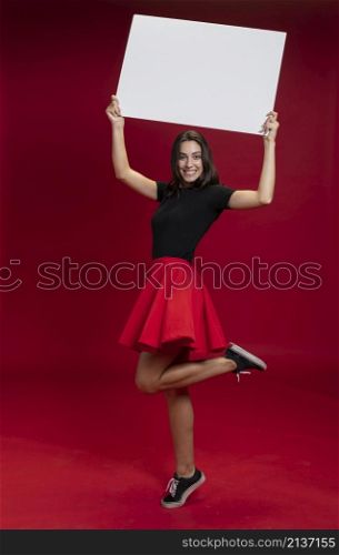 smiley woman holding empty banner