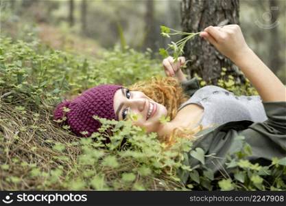 smiley woman laying grass