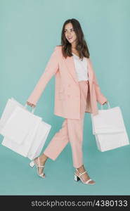 smiley woman pink suit with shopping nets