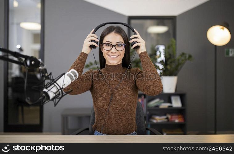 smiley woman radio with microphone headphones