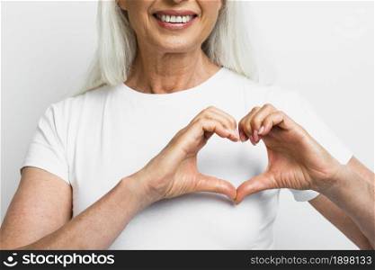 smiley woman showing heart with hands. Resolution and high quality beautiful photo. smiley woman showing heart with hands. High quality beautiful photo concept