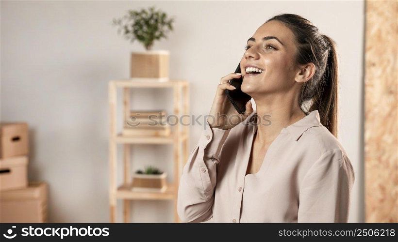 smiley woman talking phone medium shot
