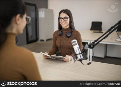 smiley women doing radio show