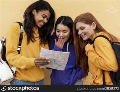 smiley women looking map
