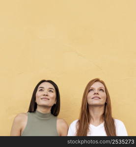 smiley women looking up with copy space