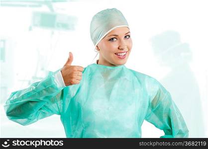 smiling a positive young beauty nurse in green operation dress with surgery cap