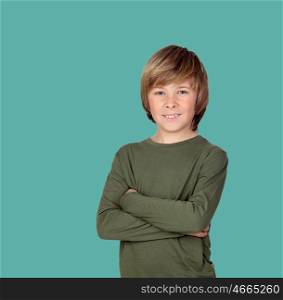 Smiling adolescent with a happy gesture on a green background