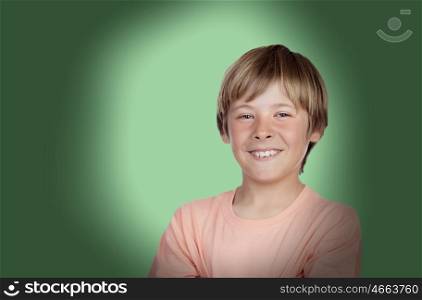 Smiling adolescent with a happy gesture on a over green background