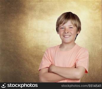 Smiling adolescent with a happy gesture on a over ocher irregular background