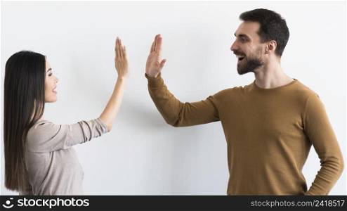 smiling adult male woman ready high five