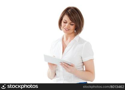 Smiling adult woman with short hair in white blouse typing on pad. Isolated. Smiling adult woman using tablet
