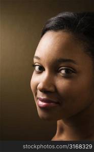 Smiling African-American young adult female looking at viewer