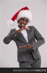 Smiling african Santa Girl presenting your product