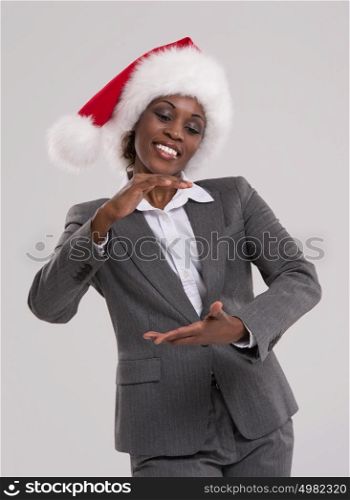 Smiling african Santa Girl presenting your product