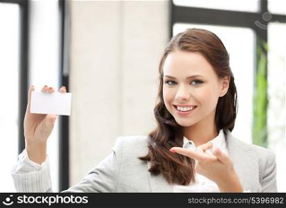 smiling and confident woman with blank business card