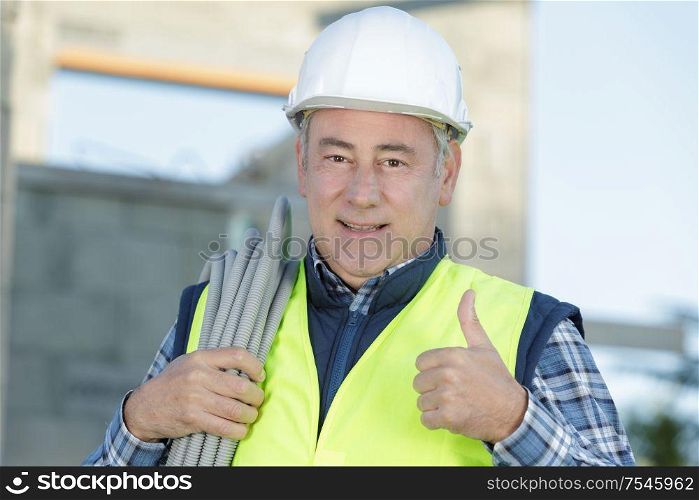 smiling and successful construction worker