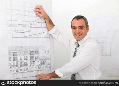 Smiling architect presenting project