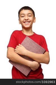 smiling asian boy holding big book isolated on white