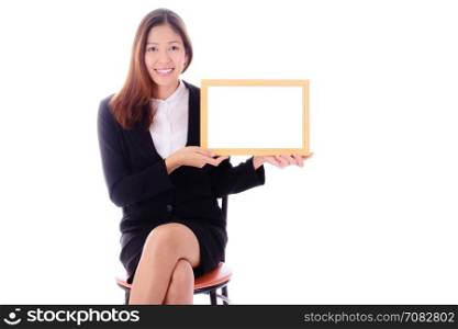 Smiling asian business woman sitting and holding banner on white background.