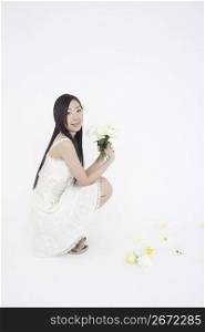 Smiling asian girl with flowers