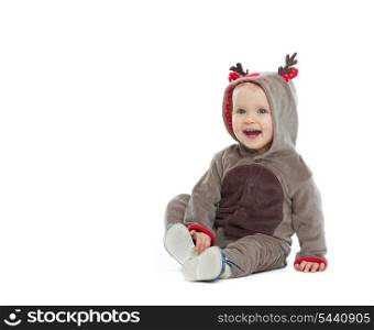 Smiling baby in Christmas costume looking on copy space
