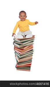 Smiling baby on a high tower books isolated on a white background