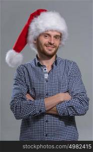 Smiling bearded christmas man over grey background