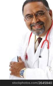 Smiling, bearded Indian doctor in lab coat and stethoscope holding cell phone